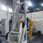 Máquina Granalladora De Cinta Rotativa Modelo ET-160 Y Cargador Para Piezas De Fundición De Hierro